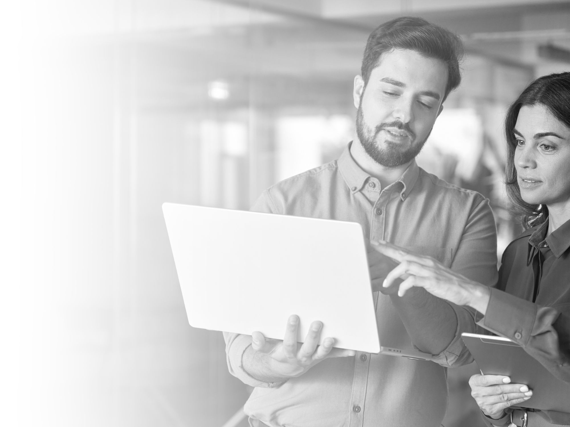 two people looking at a computer